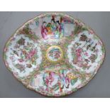 A late 19thC Canton porcelain dish of oval form, decorated with figures,