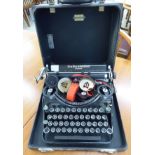 An Underwood Champion manual typewriter cased RAB