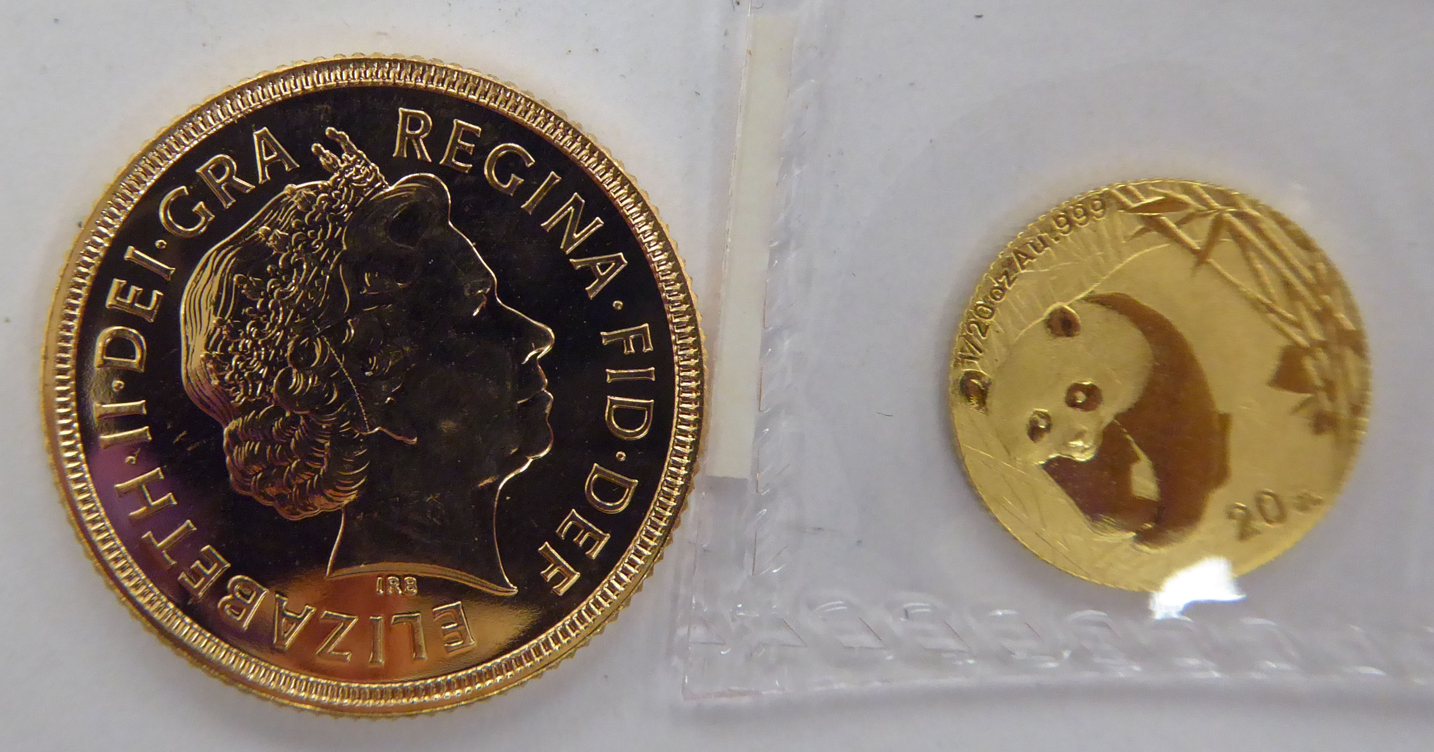 A 1/20 02 gold coin; and a Queen Elizabeth II,