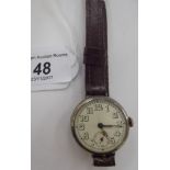 A 1930s silver cased watch, faced by an enamelled Arabic dial with subsidiary seconds,