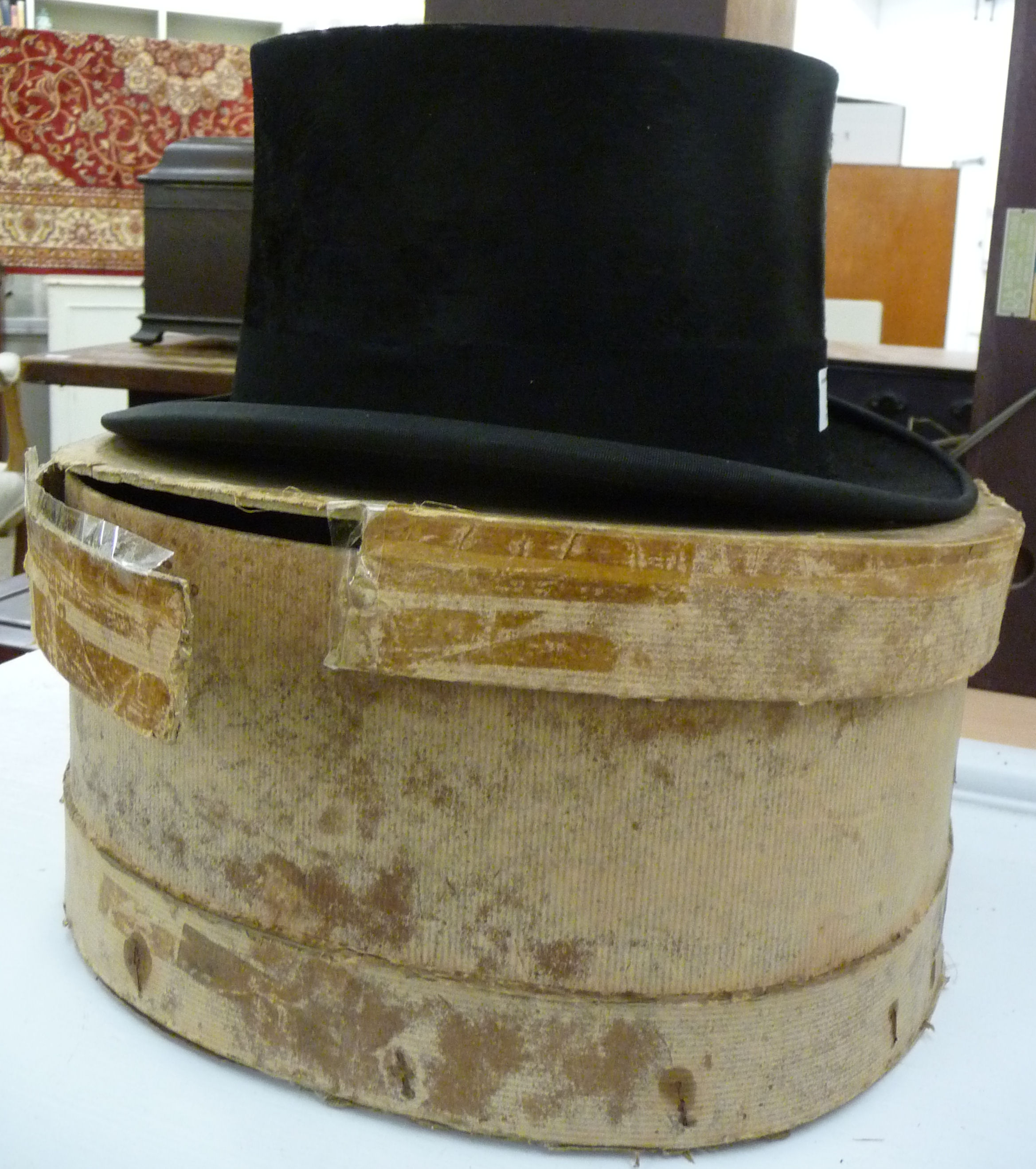 An AJ White black silk top hat (23'' inner circumference) LAB