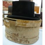 An AJ White black silk top hat (23'' inner circumference) LAB