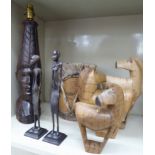 20thC African tribal items: to include a pair of cast metal standing native figures 10.