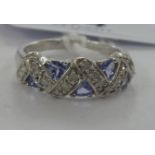 A 9ct white gold tanzanite and diamond set ring 11