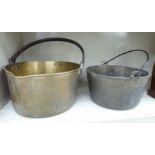 A late Victorian brass preserve pan with an iron swing handle and pouring lip 12''dia;