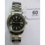 A 1966 Rolex Oyster Date stainless steel cased bracelet watch with a black dial,