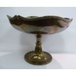 A silver sweet dish of segmented form with a raised serpentine outlined, applied wire rim,