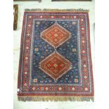 A Persian design rug with two central motifs,