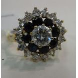 A 9ct gold claw set sapphire and cubic zirconia cluster ring 11