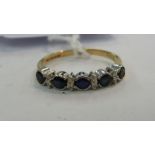 A 9ct gold five stone sapphire and diamond set half eternity ring 11