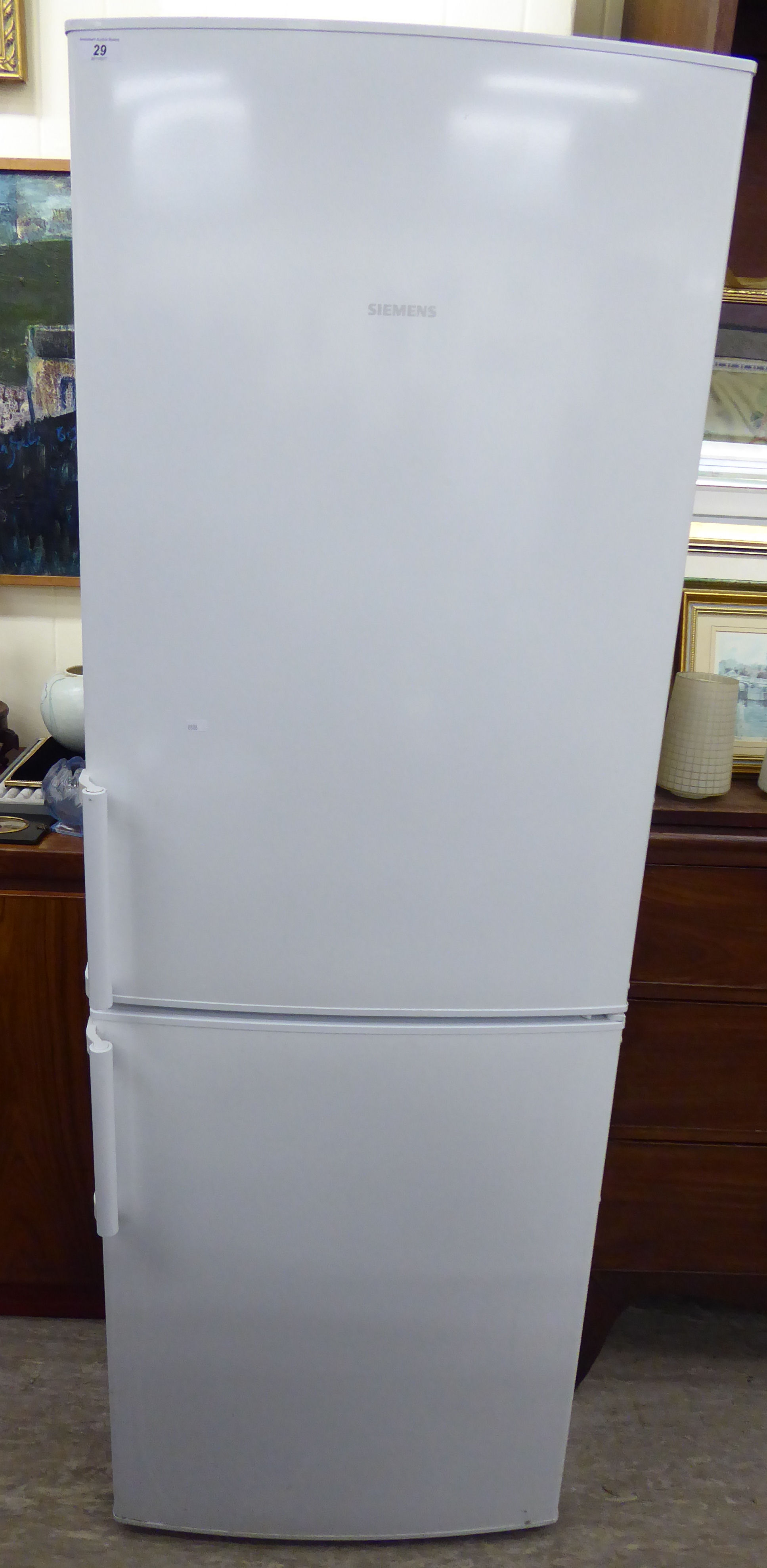 A Siemens 60/40 fridge/freezer 67''h 23.