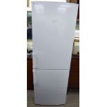 A Siemens 60/40 fridge/freezer 67''h 23.