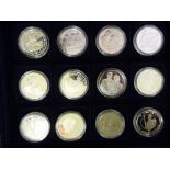 Twenty-four Franklin Mint and other silver proof coins: to include commemorative issues CS