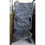 An African native carved, two part, high back, folding chair,