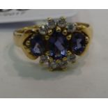 A 9ct gold claw set white and blue coloured stone ring 11