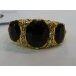 An 18ct gold claw set sapphire and diamond ring 11