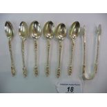 A set of six Edwardian silver coffee spoons with twist stems and apostle terminals and a pair of