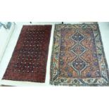 Two similar Persian rugs,