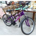 A girls Ammaco MTX300 bicycle, in purple livery with gears,