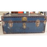 A mid 20thC rivetted blue fabric covered cabin trunk with iron fittings 13''h 30''w S