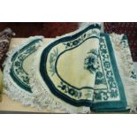 Three similar Chinese washed woollen rugs,