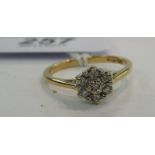 A 9ct gold claw set diamond cluster ring 11