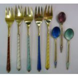A set of five Danish silver gilt pastry forks with enamelled stems;