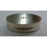 A silver oval pill box with a hinged lid Birmingham 1969 11