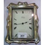 A modern silver mounted mahogany finished, battery operated clock photoframe,