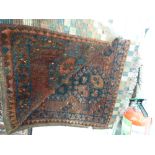 A Bokhara rug with elephant foot motifs on a red ground 40'' x 54'' CS