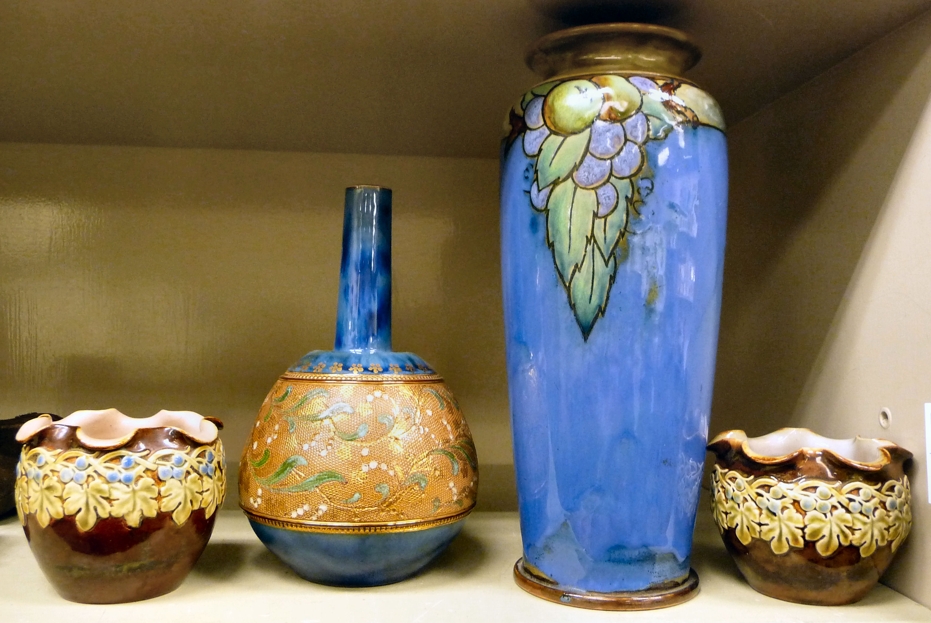 A pair of Royal Doulton brown, cream, green and blue glazed stoneware pots with frilled rims 3.