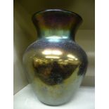 An iridescent opaque glass vase of tapered, bulbous form with a wide, flared rim 8.