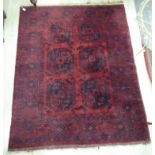 A Persian rug with two columns of three octagonal guls,