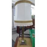 A modern cast brass table lamp with a reeded column,