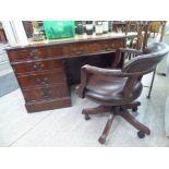 A modern mahogany finished five drawer, single pedestal desk,