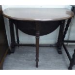 A late Victorian mahogany Sutherland table, the oval top raised on ring turned,