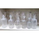 Early 20thC and later moulded and cut glass decanters of various sizes and form,