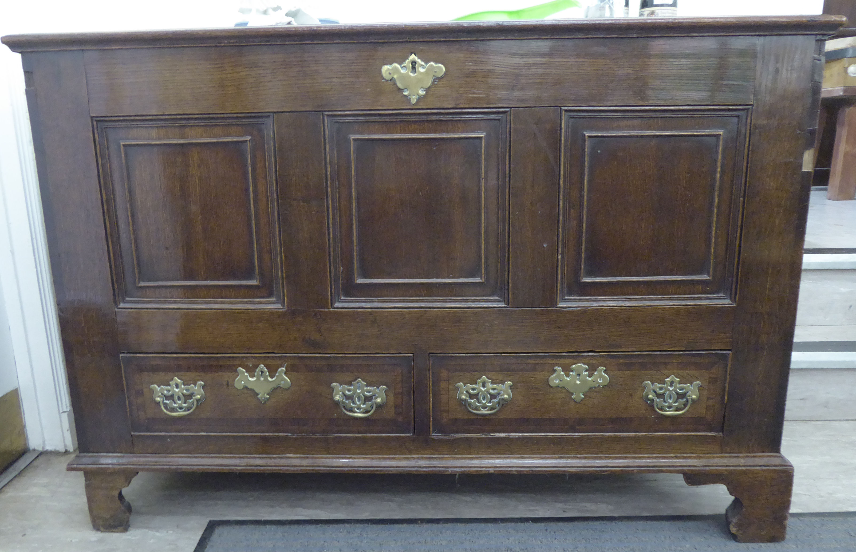 A late 18thC oak chest,