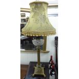 A late Victorian brass oil lamp with a hobnail cut,