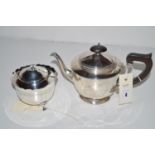 A silver teapot by Adie Bros.