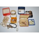 A quantity of costume jewellery, including: faux pearl necklaces; clip-on earrings; etc.