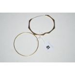 A 9ct. yellow gold octagonal bangle, 4.8grms; together with an 18ct. gold bangle, 14grms.