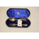 A Victorian silver christening spoon and fork (missing knife), in fitted case.