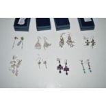 Eight pairs of mainly gem set earrings.