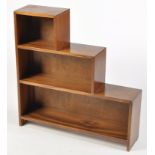 A mid 20th Century mahogany stepped open bookcase, 81 x 20 x 83cms.
