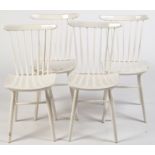 Ercol: four white painted spindle back dining chairs, 83cms high.