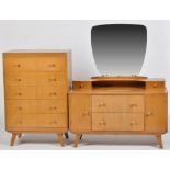 A light stained teak dressing table, with mirror back,