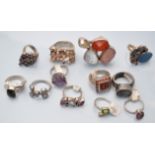 Twelve gem set silver rings.