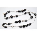 Hoorieh Coish: a banded agate and silver bead necklace,