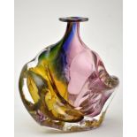 Adam Aaronson: a coloured glass vase of twisted form, 19cms high, inscribed to base and dated 1987.